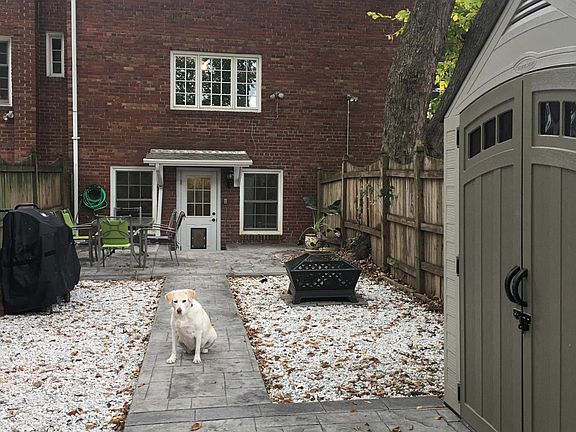 Low Maintenance Back Yard with Shed and Fire Pit