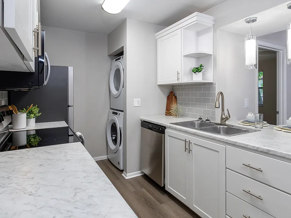 Premiere kitchens dressed in marble-style countertops, a chic tile backsplash, and a breakfast bar to cherish.