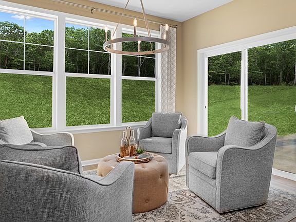 Morning room with triple window sliding glass door in a DRB Homes Starling Model Home in the Grand