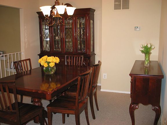 Separate Dining Room overlooks Sunken Living Room, Deck