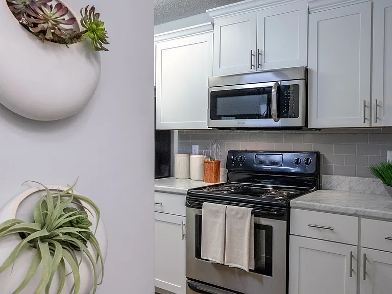 Every detail contributes to an upscale living experience in our upgraded kitchens, from the stainless-steel appliances embraces by Carrara marble-inspired countertops to the pristine white shaker cabinetry.