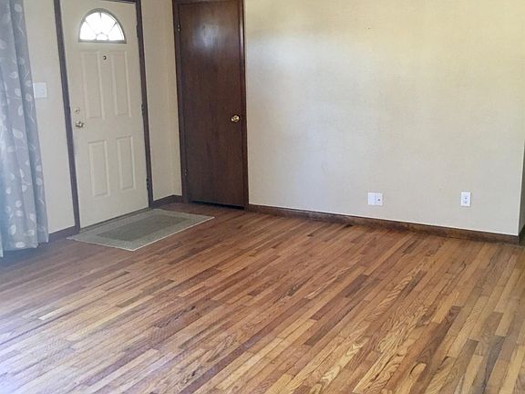 Living Room with hardwood floors. Interior has been freshly painted