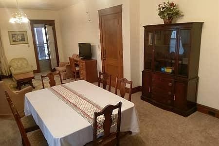 Door to apartment from porch and hallway.