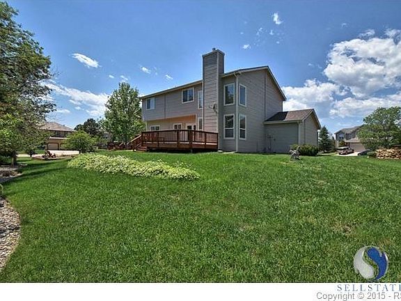 View of the back of the home with a great deck