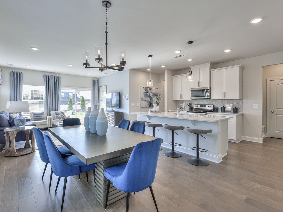 The stunning open-concept floorplan allows for an easy flow between the kitchen and dining area