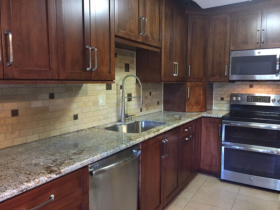 beautifully updated kitchen with custom cabinets