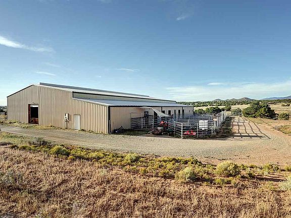 Includes seven stall barn & heated tack room.