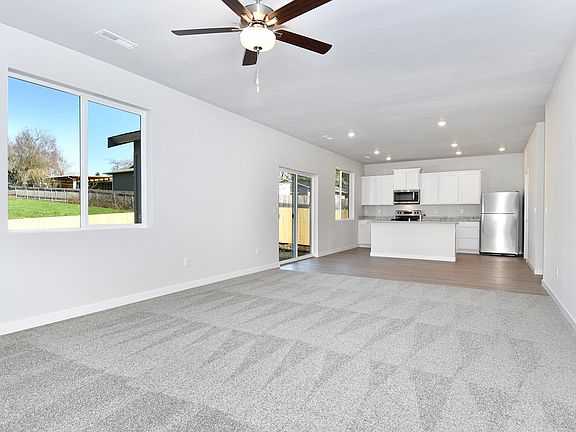 The open layout of the Mercer has the family room open to the kitchen.