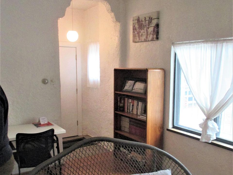 Corner of living room looking toward main entrance.