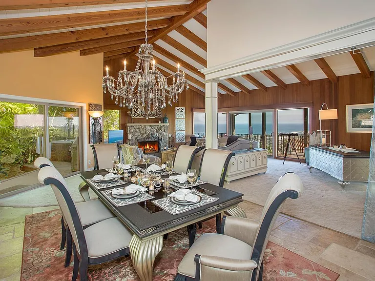 Savor panoramic views of the ocean and harbor while relaxing or entertaining loved ones in the expansive living room.