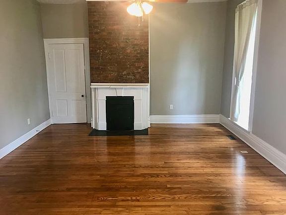 Living Room with exposed brick fireplace