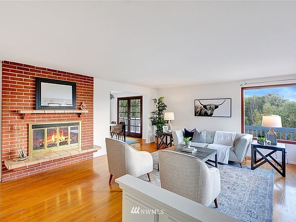 Raised hearth fireplace with brick surround.