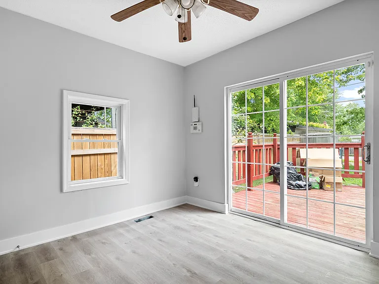Main floor bedroom with access to back patio