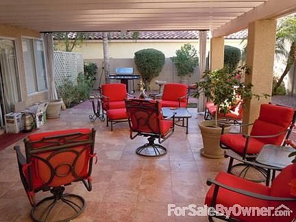 Rear Covered Patio
						:
						Tile patio and red brick landscaping