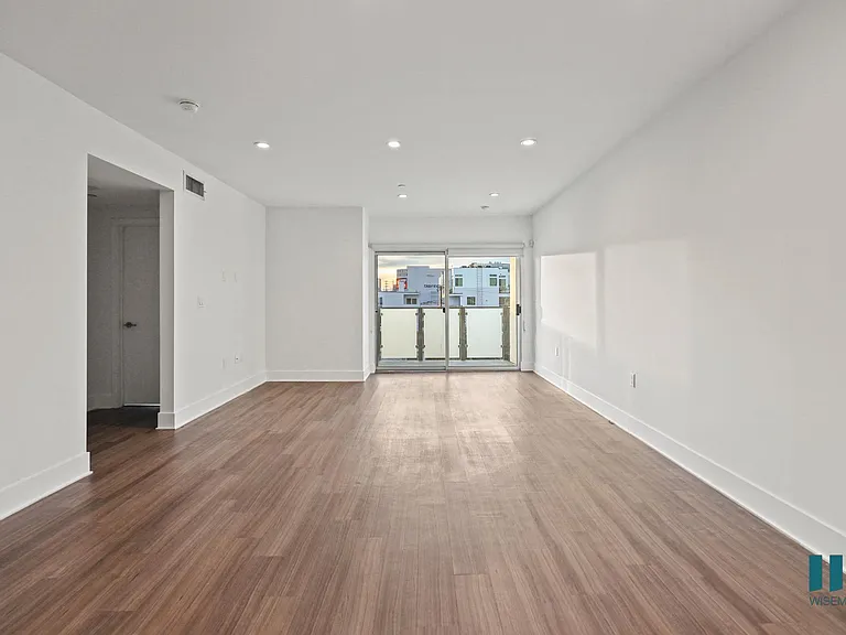 Open-Concept Dining and Living Room with Patio