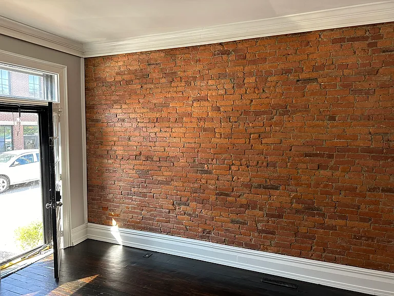 Exposed brick wall in living room