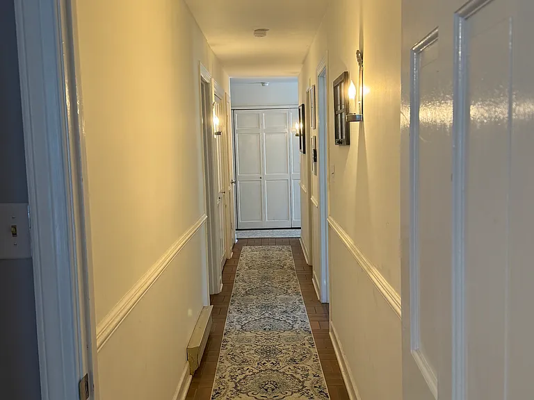 Downstairs hallway view from back office suite/bedroom