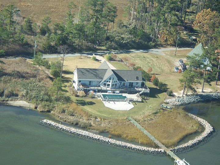 Perfect waterfront front and back!
						:
						Property view from the air. It is a paradise for anyone who loves the water!