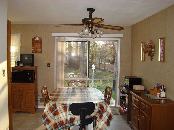 Eating area or dining room with view of kitchen and family room