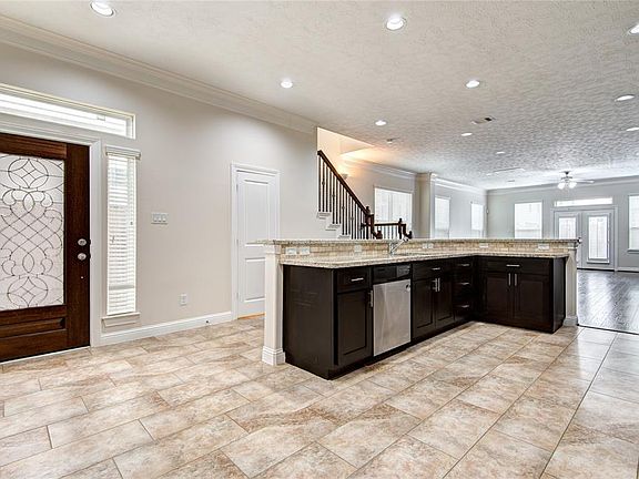 Entry - Come on in and have a look around. Lots of windows result in an abundance of natural lighting. The kitchen island is to the right with dining area to the right of the kitchen.