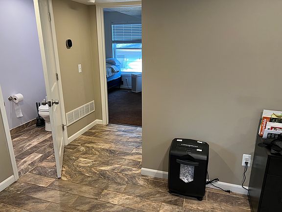 Down stairs half bathroom adjacent to kitchen / bedroom entrance
