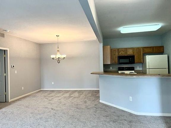 dining area and kitchen with space for bar stools