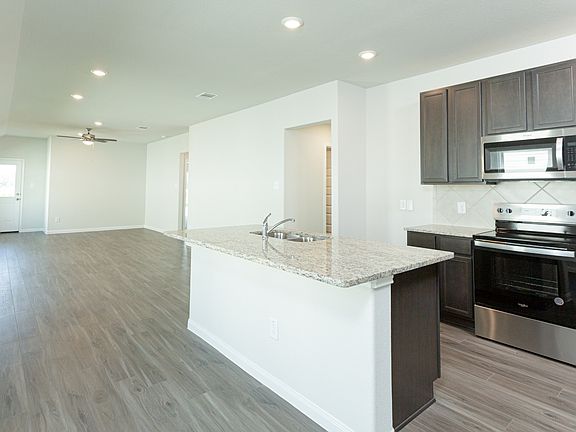 Dining Area to Kitchen and Family Room