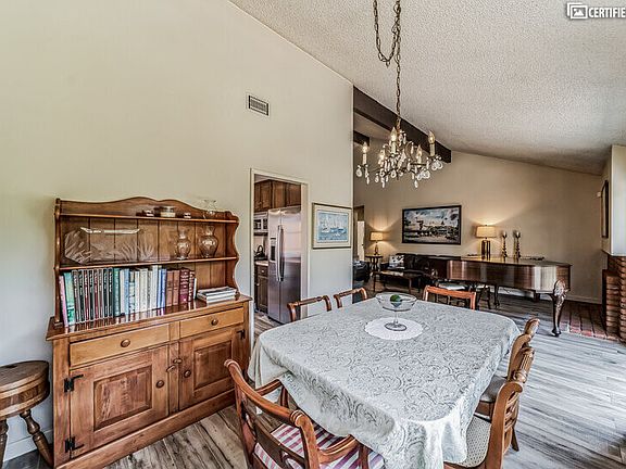 Sewing supplies, flower vases, and padded table