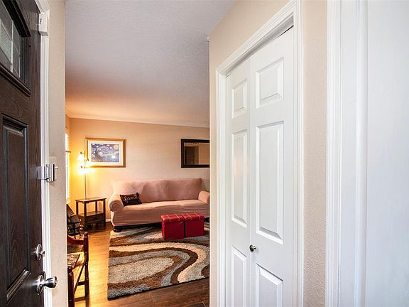 As you enter the townhome you are greeted with beautiful laminate flooring. To the left of the entryway is the spacious family room.