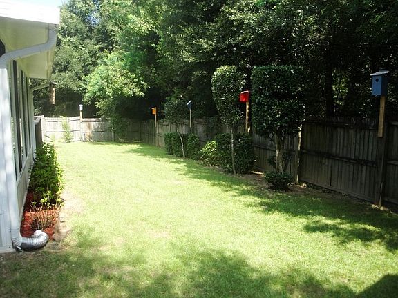 View of Backyard, Birdhouses, and Woods