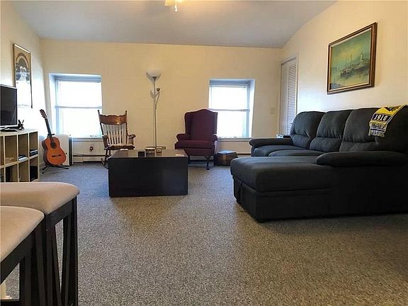 Abundant natural light and plenty of room to furnish in this open living room. PLEASE READ DESCRIPTION FOR START DATE AND LENGTH OF LEASE!