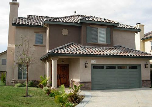 A beautifully landscaped front yard with outstanding curb appeal at the end of a cul-de-sac.