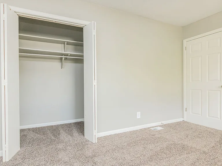 Bedroom with carpet