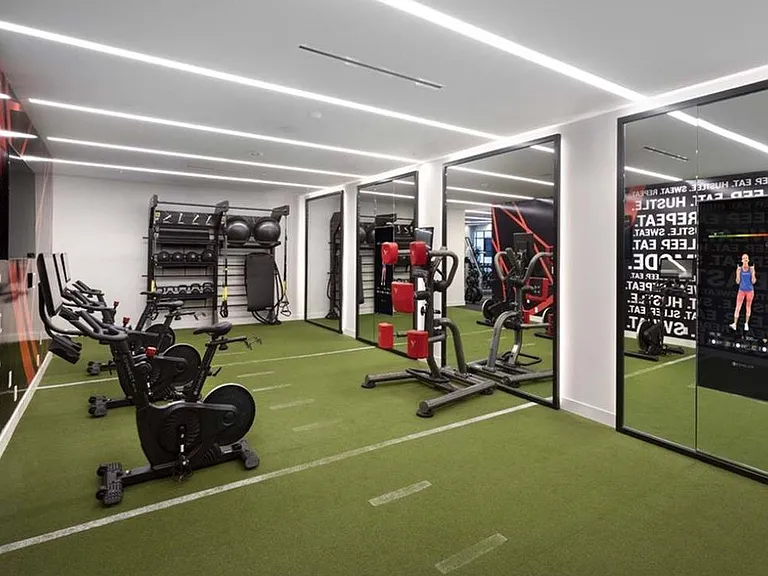 Premium HIIT-inspired fitness center with TRX, spin bikes, virtual fitness options, and weights
