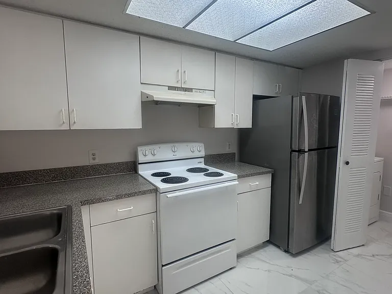 5011 Wiles Rd #207 — Photo 7