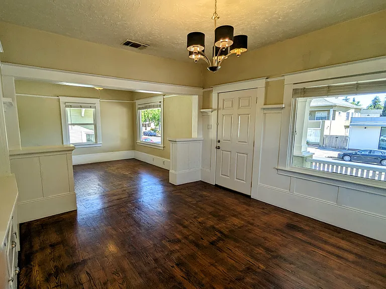 Original wood floors and built in cabinetry retain period charm and elegance.