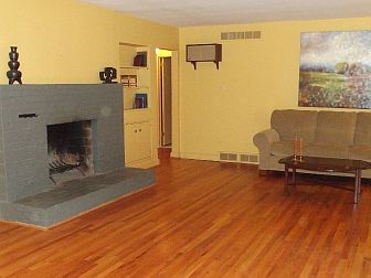 Brick fireplace & hearth in living room/great room