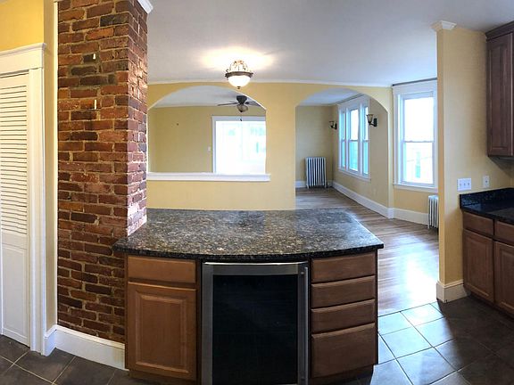 Kitchen view into dining and living rooms