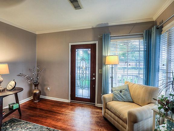 Rich hardwood floors throughout the living area & bedrooms.