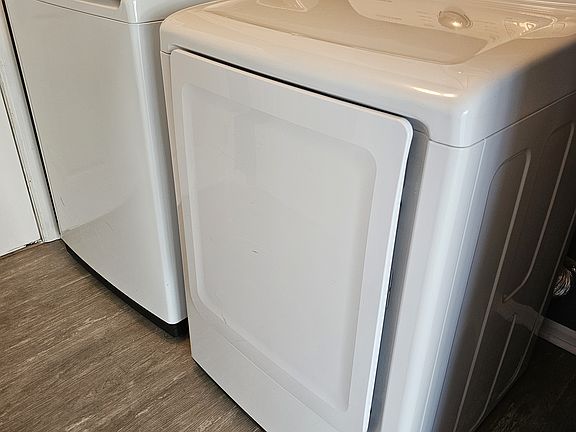 Samsung washer large top load/dryer. ADT system in this room.