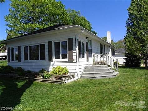 Well-Maintained 3 Bedroom Home less than a block from the Round Lake public beach.
