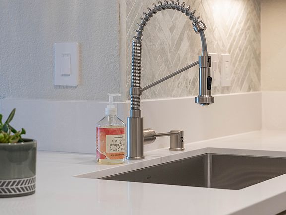 Brand new Kraus sink and faucet for style and convenience.