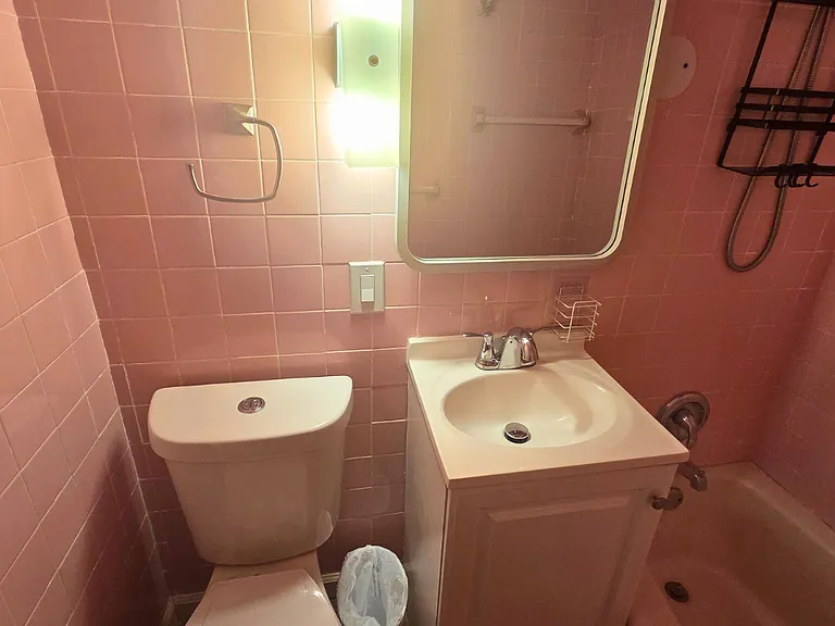 Vanity with cabinet storage for toiletries and personal essentials.