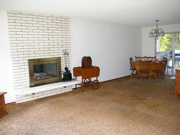 Living room and dining area with slider to deck for barbeques.