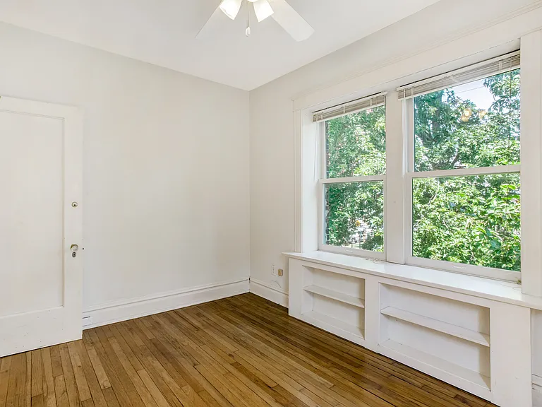 Bedroom with built in bookcase
