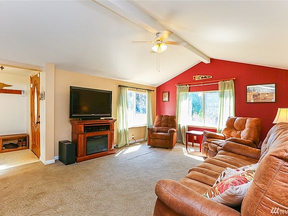 Bright and open living space with vaulted ceiling and a an inviting atmosphere. 