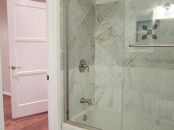 Master bathroom with marble tiles