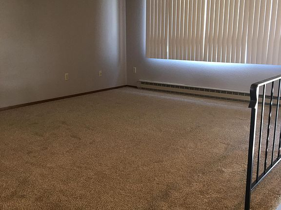 Spacious living room opens to kitchen