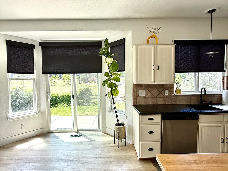 Custom Hunter Douglas shades in kitchen halfway closed