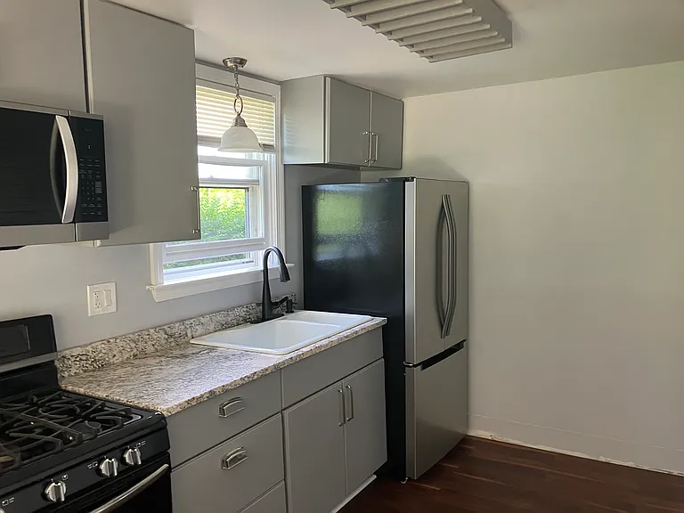 Newly renovated kitchen with granite and stainless steel appliances.